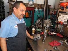 adolfo at the transmission repair table